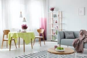 Living And Dining Room In Modern Apartment With Grey Couch And W Espacios Hábitat Bienes Raíces Inmobiliaria En Hermosillo Especializada En Bienes Raíces